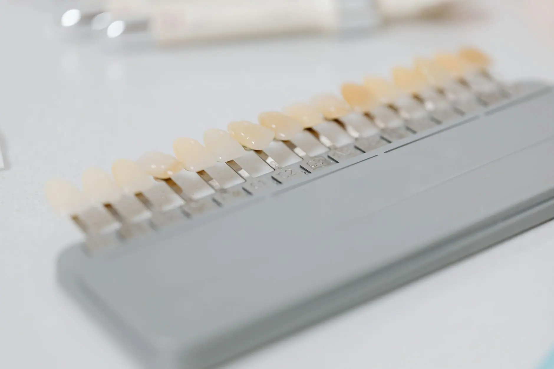 Close-up image of a dental shade guide displaying various tooth color options.