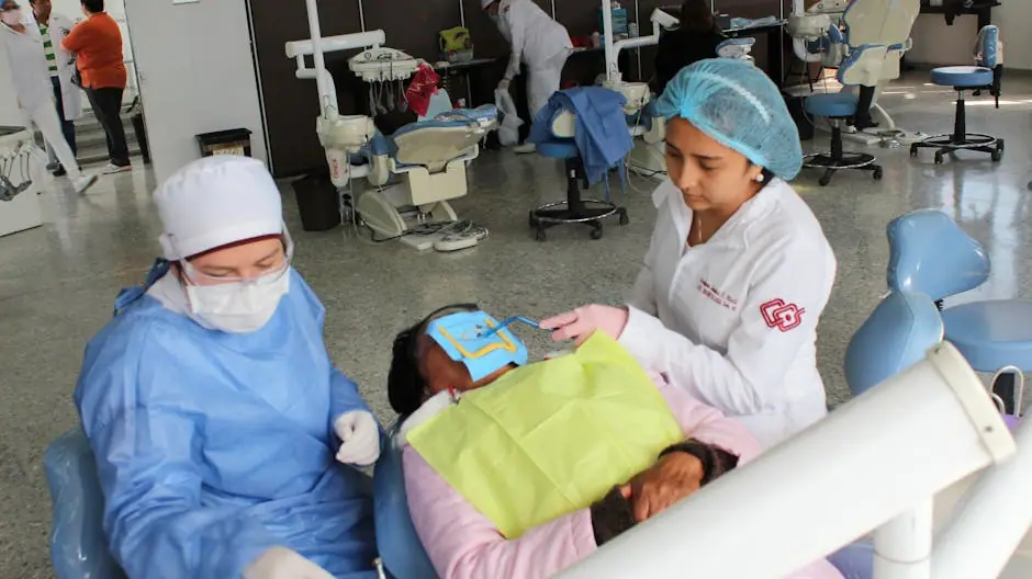 Dentists working on a patient during a dental procedure in a modern clinic setting.