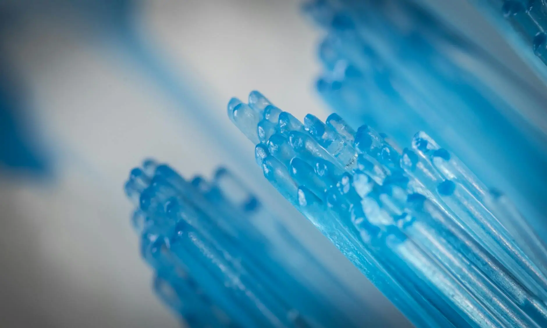 Close-up of blue toothbrush bristles, capturing intricate details and textures.