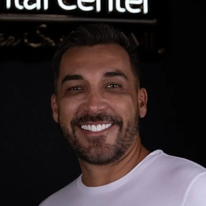 Patient at the Smile Dental Center clinic sign — Bird Road, Miami, FL
